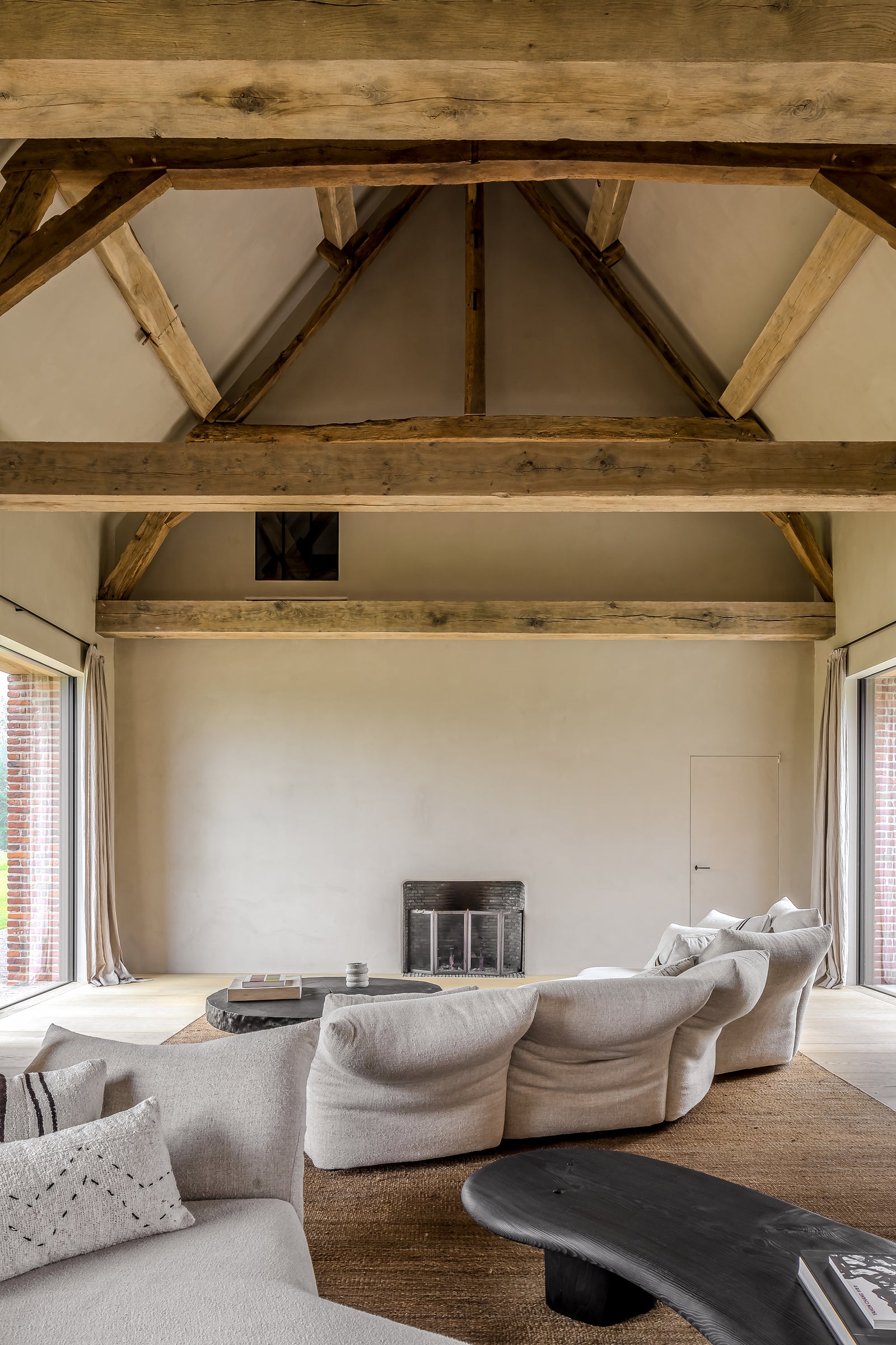 Modern living room with wooden beams and neutral decor